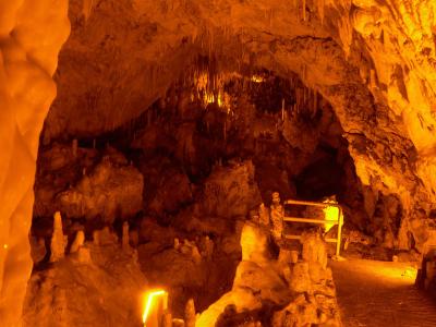 Illuminated stalactites and stalagmites inside Perama Cave near Ioannina