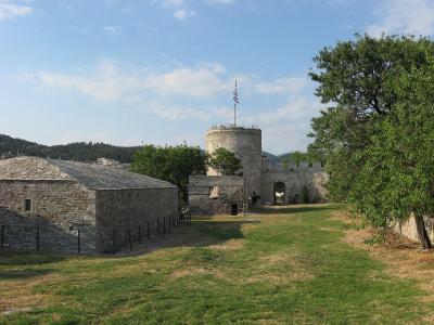 Round tower and stone buildings inside Kavala castle