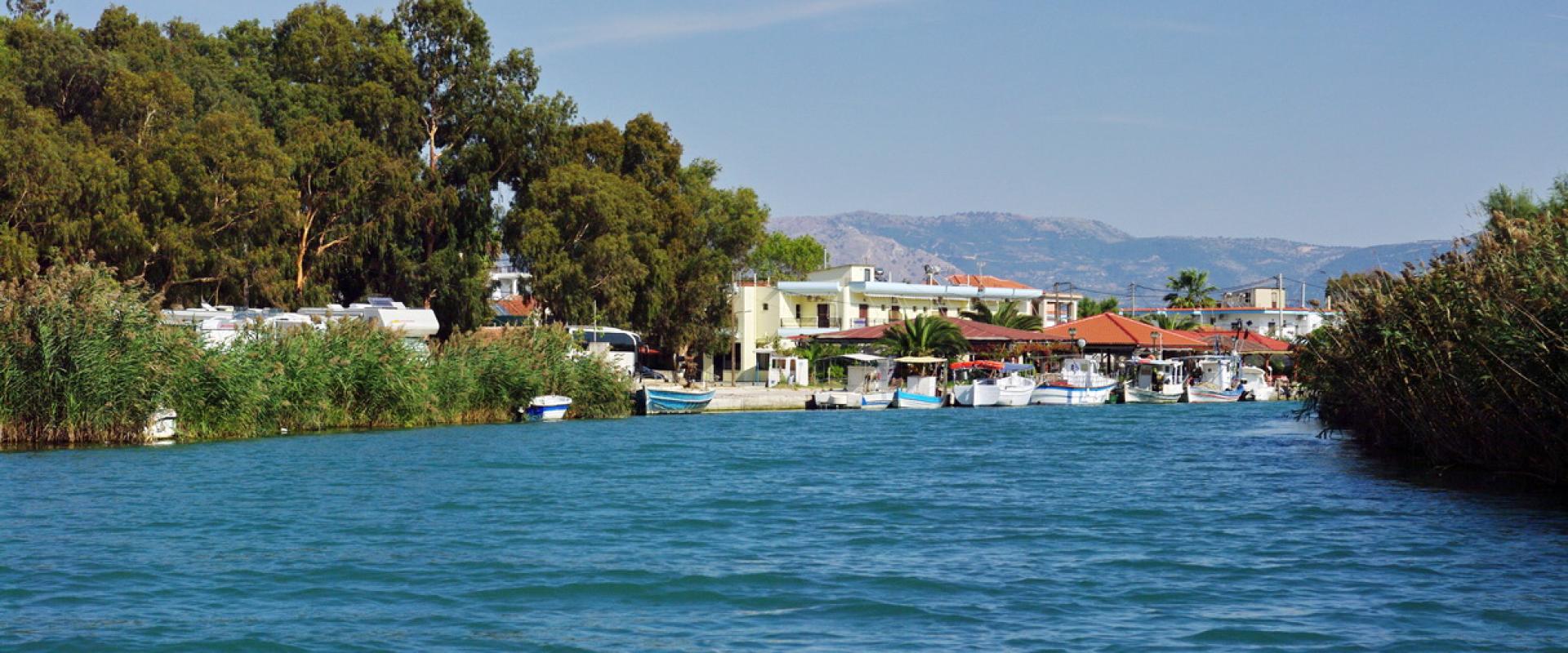 The Acheron river mouth at Ammoudia with fishing boats and the village