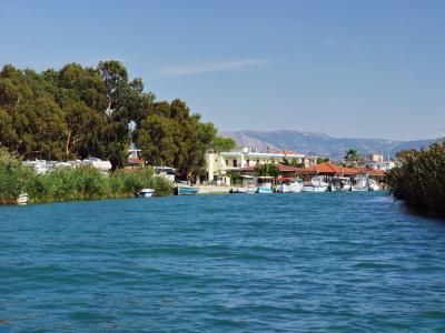 The Acheron river mouth at Ammoudia with fishing boats and the village