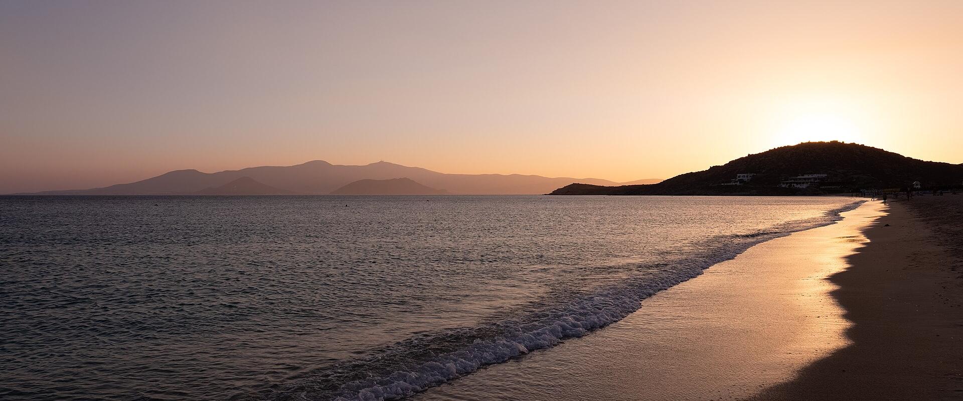 Sunset over the sandy beach of Agios Prokopios on Naxos