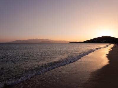 Sunset over the sandy beach of Agios Prokopios on Naxos