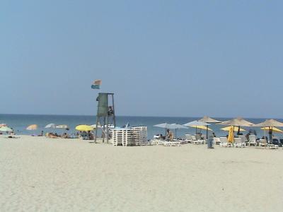 Sandy beach with umbrellas at Neoi Poroi on the Pieria coast