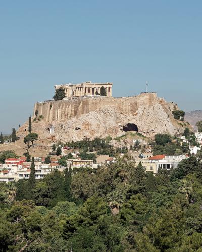 The Acropolis of Athens rising above the pine-covered slopes
