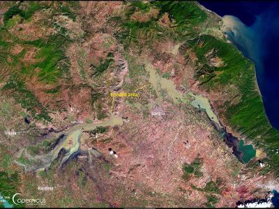 A satellite map image showing the Thessaly region of Greece, highlighting the Pinios River basin and the city of Larissa with a yellow annotation marking the "Flooded area" and a Copernicus Emergency Management Service logo.