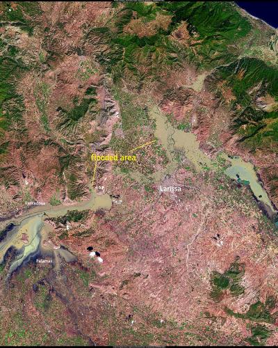 A satellite map image showing the Thessaly region of Greece, highlighting the Pinios River basin and the city of Larissa with a yellow annotation marking the "Flooded area" and a Copernicus Emergency Management Service logo.