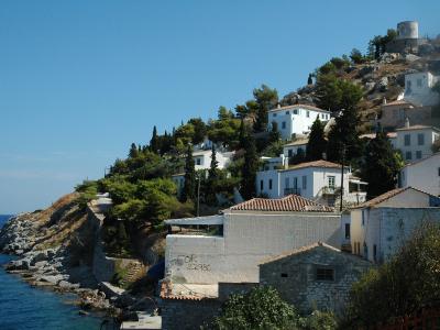 Whitewashed houses of Kamini village above the rocky shore on Hydra