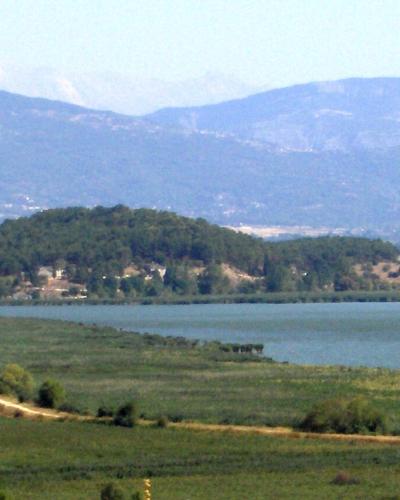 The Island of Ioannina in Lake Pamvotida with the mountains behind