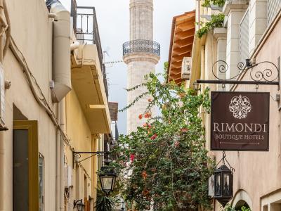 The minaret of the Neratze Mosque rising above a narrow lane in Rethymno old town