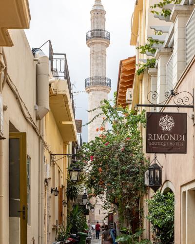 The minaret of the Neratze Mosque rising above a narrow lane in Rethymno old town
