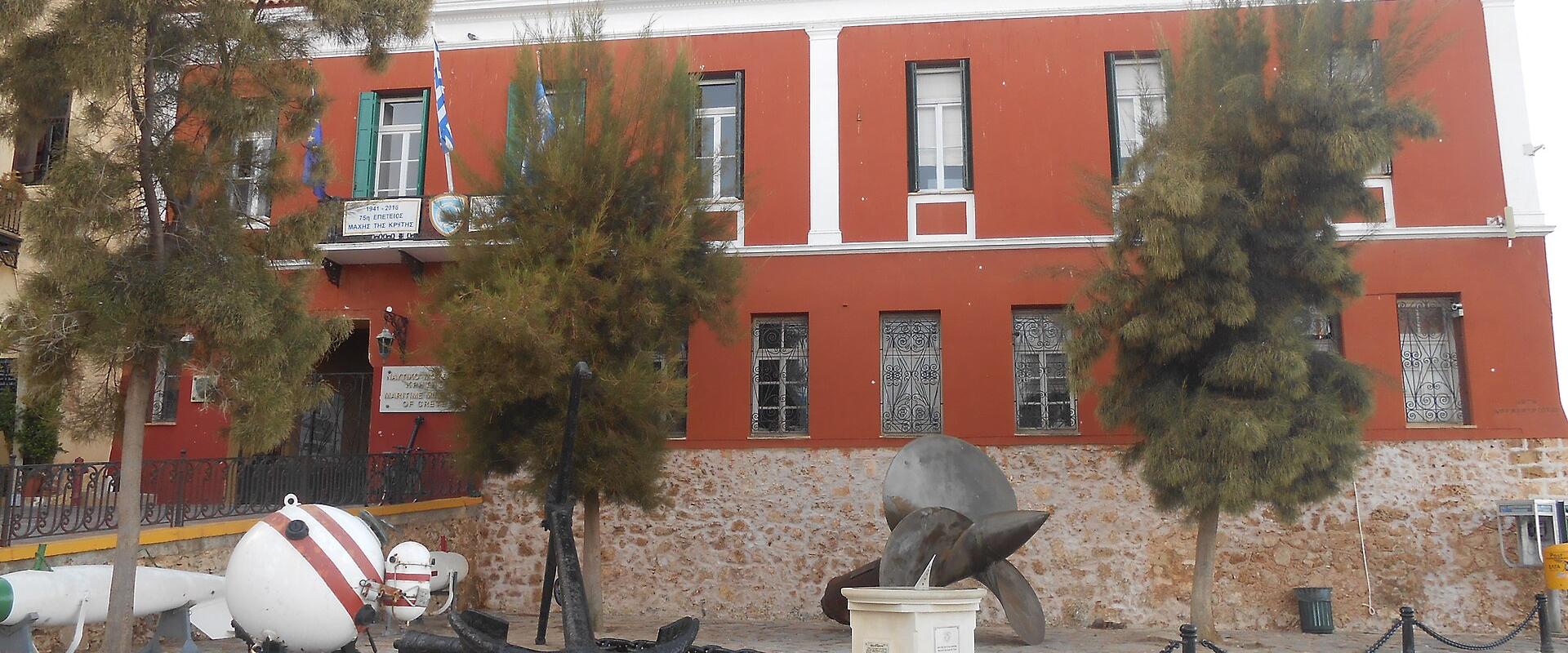 The red facade of the Maritime Museum of Crete in Chania