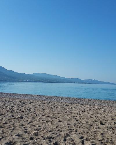Pebble beach of Kalamata with the Taygetos mountains beyond