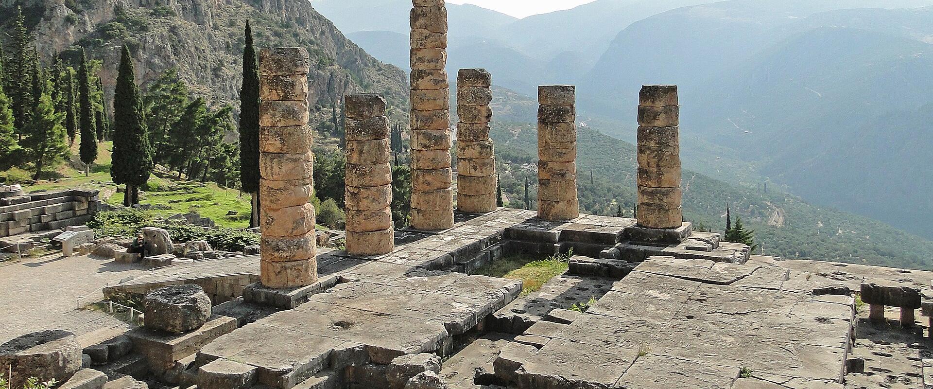 The columns of the Temple of Apollo at Delphi beneath Mount Parnassus